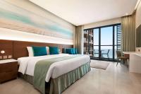 Postel nebo postele na pokoji v ubytování Wyndham Garden Ajman Corniche