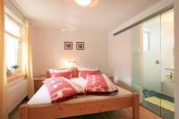 A bed or beds in a room at Migglwieshof