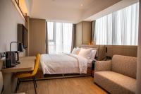lyf Xi'an Dayanta by Ascott free gym & self-service free laundry roomにあるベッド
