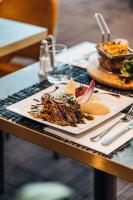 a plate of food on top of a table at Mercure Aix-en-Provence La Duranne Gare TGV in Aix-en-Provence