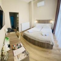 Łóżko lub łóżka w pokoju w obiekcie Fenyves Szálloda és Konferencia-Központ