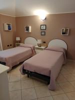 A bed or beds in a room at casa vacanza Le 2 Isole