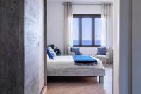 A bed or beds in a room at "Sunset Garden" apartment