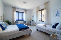 A bed or beds in a room at "Sunset Garden" apartment