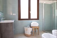 A bathroom at "Sunset Garden" apartment
