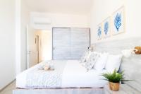 A bed or beds in a room at "Sunset Garden" apartment