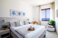 A bed or beds in a room at "Sunset Garden" apartment