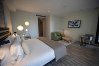 A bed or beds in a room at abba Sevilla