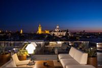 A seating area at abba Sevilla