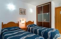 Posteľ alebo postele v izbe v ubytovaní Apartamentos Caracas