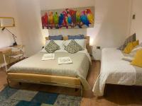 A bed or beds in a room at B&B Maggiore 58