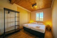 Postel nebo postele na pokoji v ubytování Valnovka Wellness Hotel