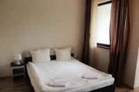 Postel nebo postele na pokoji v ubytování Borovets Gardens Apartments