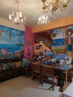 a living room with a table and a dining room at Hualien Seaside B&amp;B in Hualien City