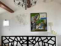 a dining room with a table and a picture on the wall at CASA GUASCO superbe duplex au cœur de la Citadelle, vue à 360 in Bastia