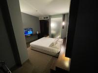 A bed or beds in a room at Bes Hotel Cremona Soncino