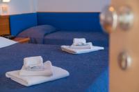 Łóżko lub łóżka w pokoju w obiekcie Ciccio Hotel