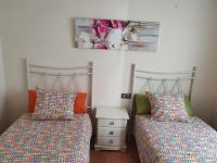 Posteľ alebo postele v izbe v ubytovaní Apartamentos Nordés2