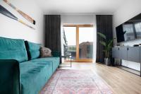 Televízia a/alebo spoločenská miestnosť v ubytovaní NAP Apartments Nadmotławie Marina