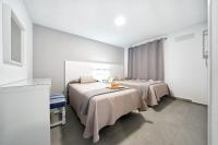 Posteľ alebo postele v izbe v ubytovaní Apartamentos Los Papagayos