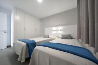 Posteľ alebo postele v izbe v ubytovaní Apartamentos Los Papagayos