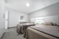 Posteľ alebo postele v izbe v ubytovaní Apartamentos Los Papagayos