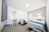 Posteľ alebo postele v izbe v ubytovaní Apartamentos Los Papagayos