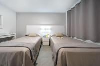 Posteľ alebo postele v izbe v ubytovaní Apartamentos Los Papagayos