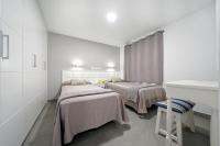 Posteľ alebo postele v izbe v ubytovaní Apartamentos Los Papagayos