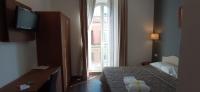 Posteľ alebo postele v izbe v ubytovaní Rome Travellers Hotel