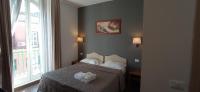 Posteľ alebo postele v izbe v ubytovaní Rome Travellers Hotel