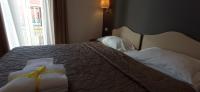 Posteľ alebo postele v izbe v ubytovaní Rome Travellers Hotel