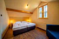Postel nebo postele na pokoji v ubytování Valnovka Wellness Hotel