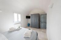 A bed or beds in a room at Trullo Lillo