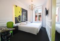 Łóżko lub łóżka w pokoju w obiekcie Posada del Dragón Boutique Hotel