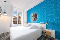 Łóżko lub łóżka w pokoju w obiekcie Posada del Dragón Boutique Hotel