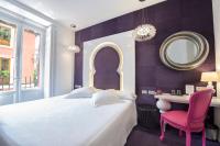 Łóżko lub łóżka w pokoju w obiekcie Posada del Dragón Boutique Hotel