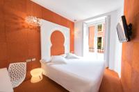 Łóżko lub łóżka w pokoju w obiekcie Posada del Dragón Boutique Hotel