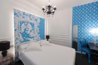 Łóżko lub łóżka w pokoju w obiekcie Posada del Dragón Boutique Hotel