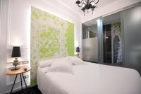 Łóżko lub łóżka w pokoju w obiekcie Posada del Dragón Boutique Hotel