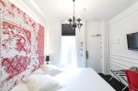 Łóżko lub łóżka w pokoju w obiekcie Posada del Dragón Boutique Hotel