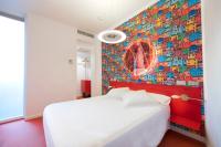 Łóżko lub łóżka w pokoju w obiekcie Posada del Dragón Boutique Hotel