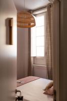 A bed or beds in a room at Mapango Small Rooms