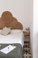 A bed or beds in a room at Mapango Small Rooms