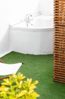 A bed or beds in a room at Mapango Small Rooms