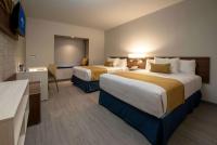 Microtel Inn & Suites by Wyndham Guadalajara Surにあるベッド