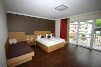 Łóżko lub łóżka w pokoju w obiekcie Hotel Herzblut - Joker card included in summer