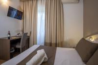 Łóżko lub łóżka w pokoju w obiekcie Hotel La Pergola