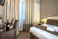 Łóżko lub łóżka w pokoju w obiekcie Hotel La Pergola