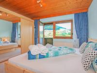 a bedroom with a bed with towels on it at Holiday Home Haselwanter by Interhome in Sellrain